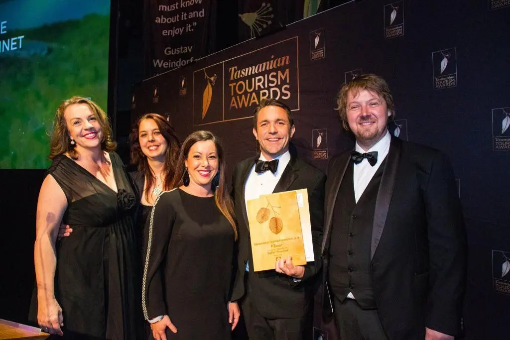 Peter Walker standing with clients who have received awards 2018 Tasmanian Tourism Awards.