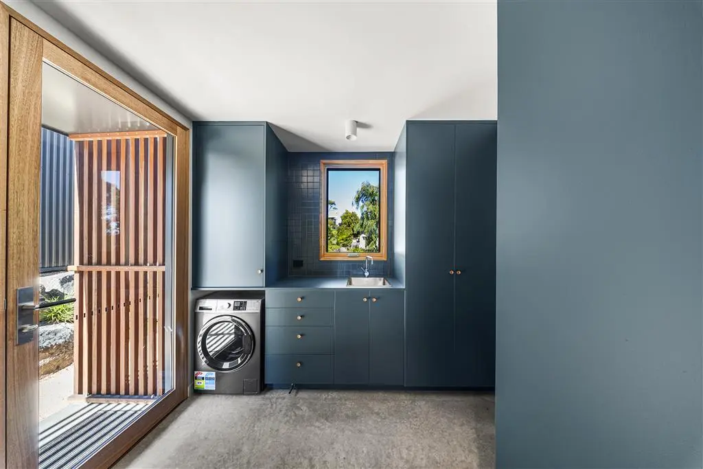 a laundry room that looks out into a courtyard