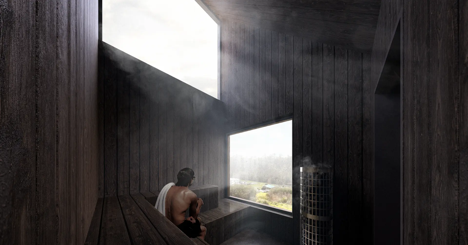A compact sauna interior lined entirely with dark timber panelling has tiered bench seating, looking out of two large windows framing the landscape and sky respectively, contrasting the warm, enclosed space with the cooler landscape beyond.