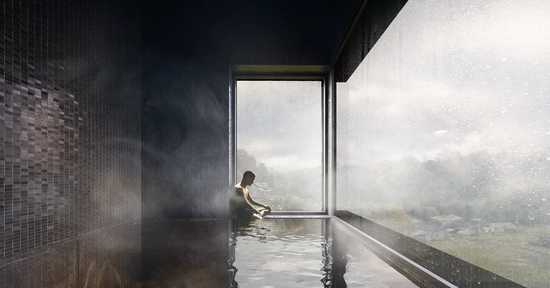A dimly lit hot pool lined with dark, square mosaic tiles reflects light from large corner windows looking out into the valley, creating a calm, enclosed bathing environment.