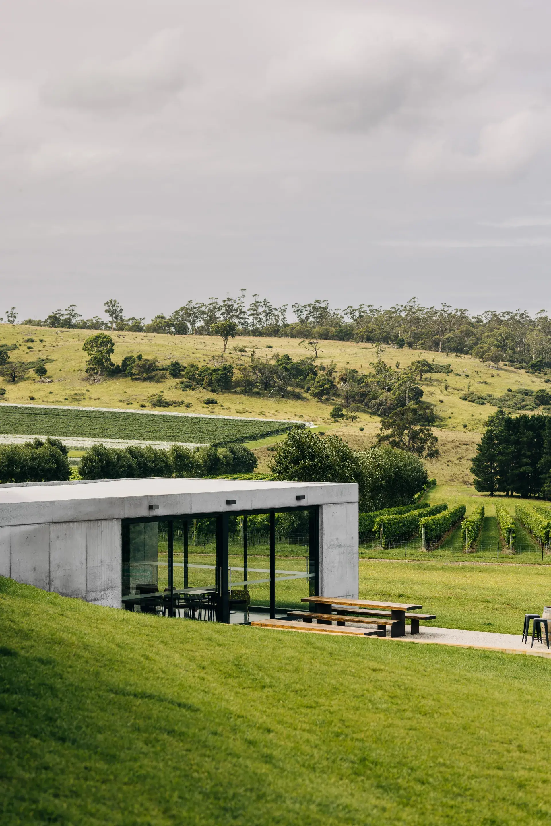 The new restaurant space sits within the rolling grassy landscape.