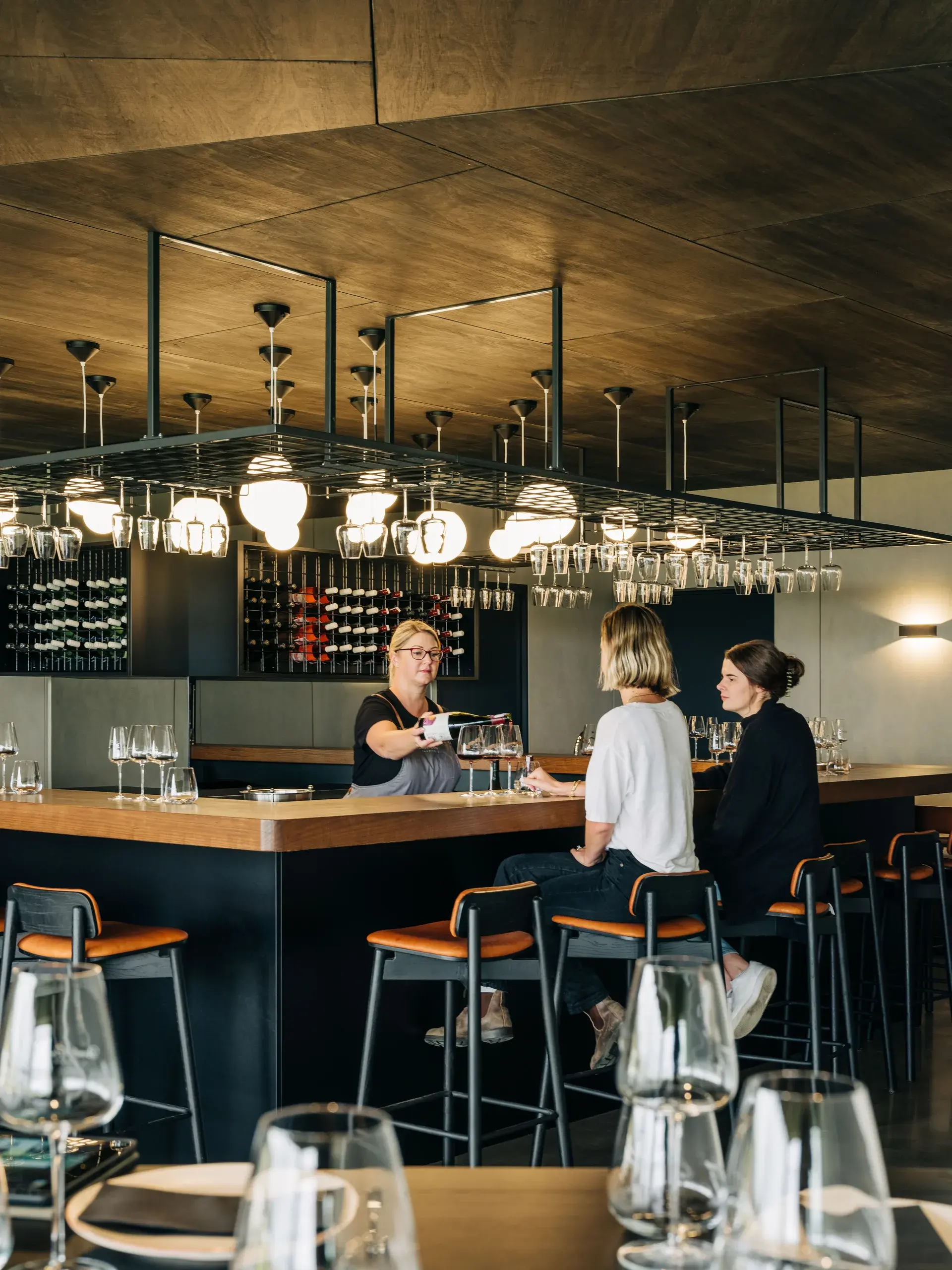 Visitors tasting wine at the new bar.