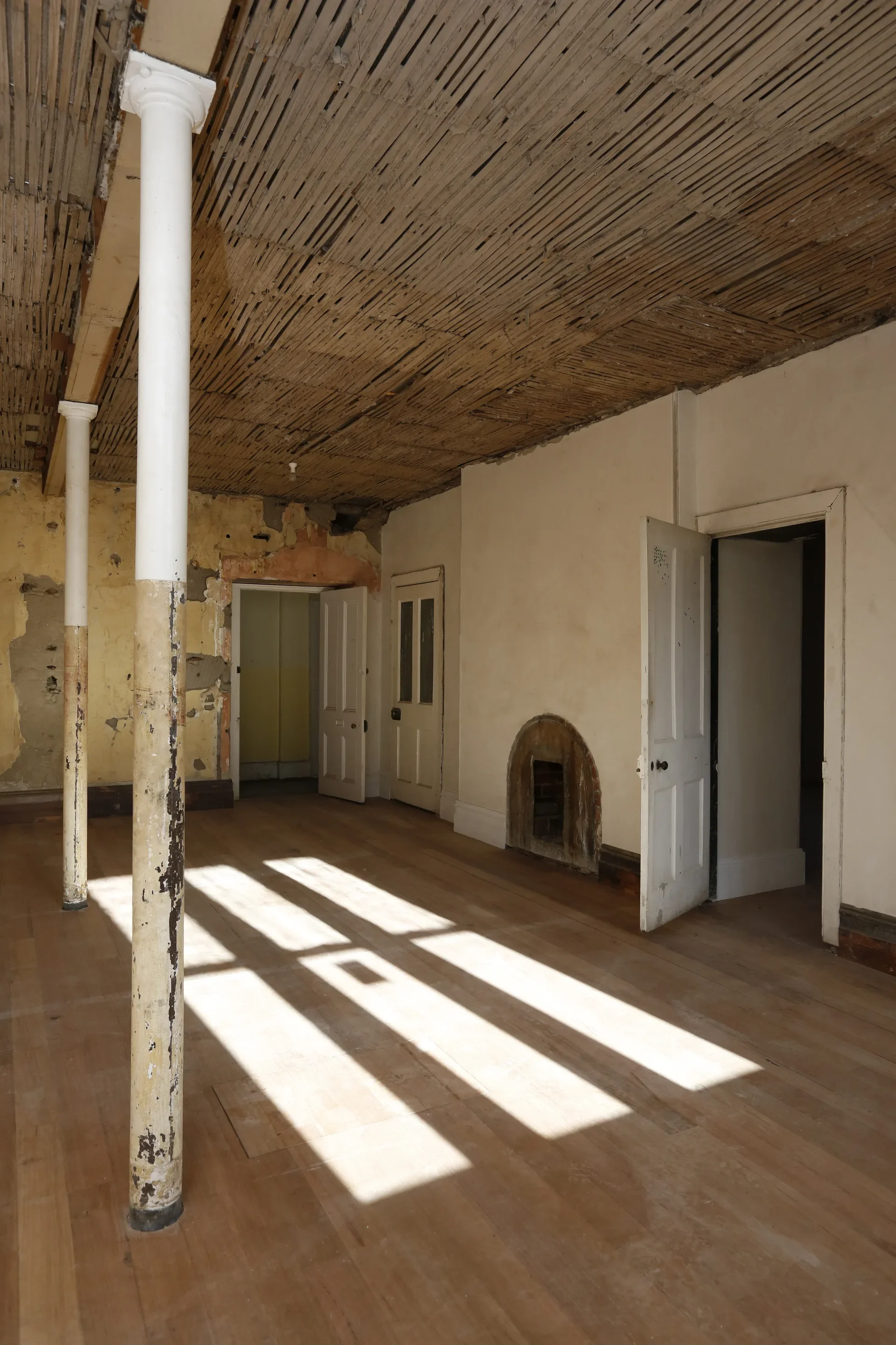 The original fabric has been exposed - including the structure of the ceiling.