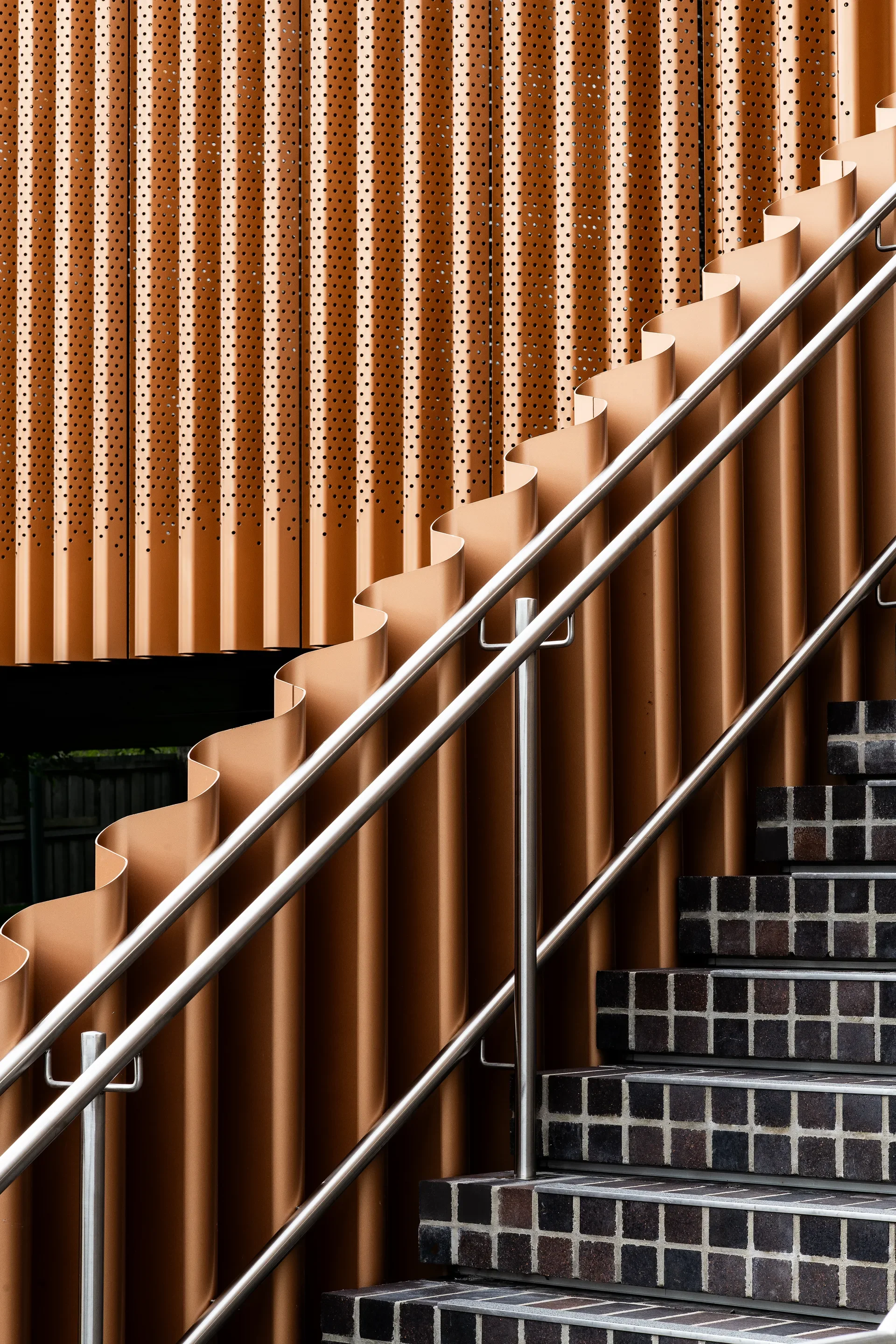 The copper toned external cladding and the rear entry stair.