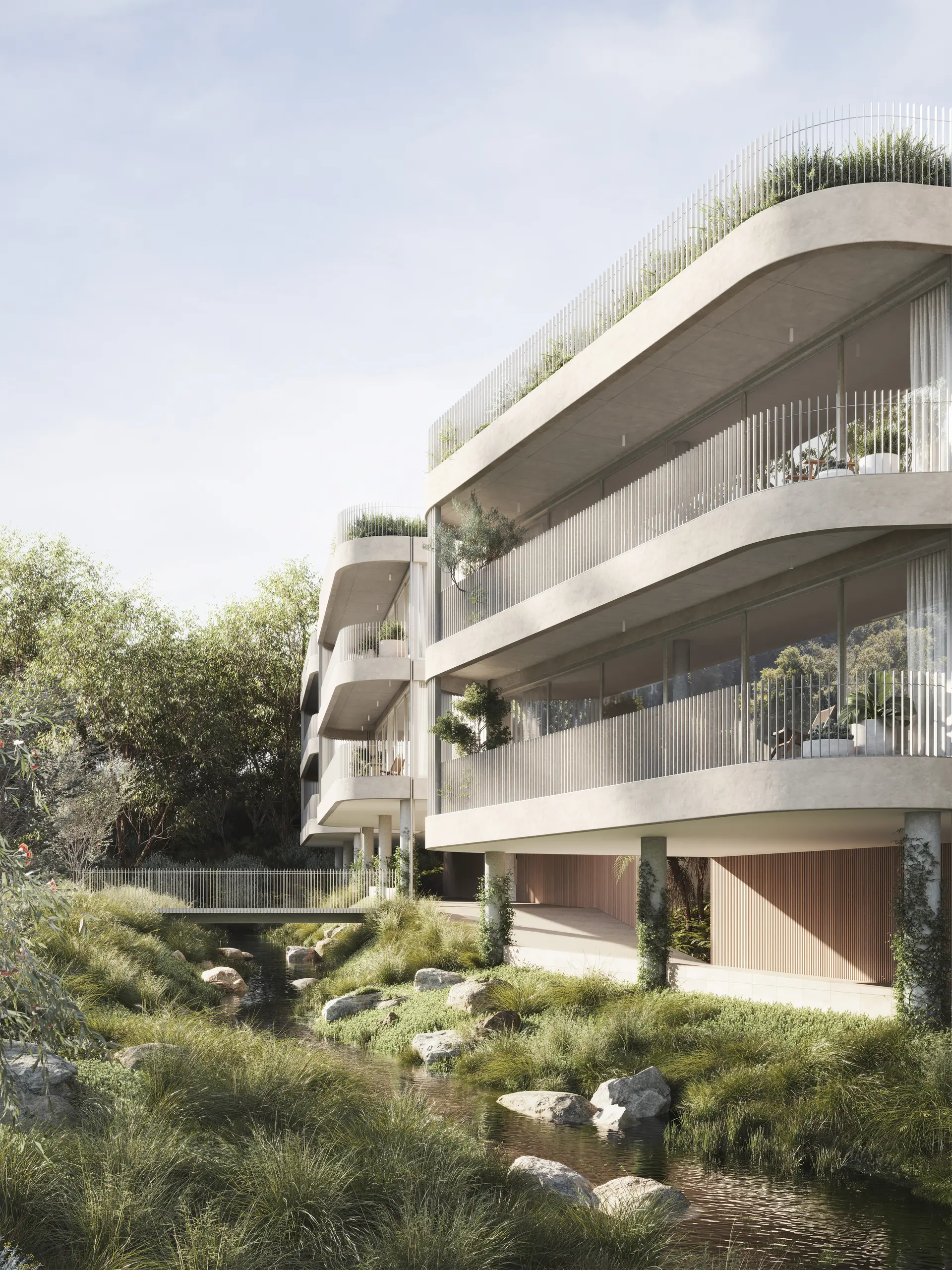 An exterior render looking along the building edge, with stacked, curved concrete slabs forming continuous balconies, screened by fine vertical metal balustrades. The façade combines off-form concrete, timber-lined soffits and integrated planter beds, overlooking a densely vegetated creek corridor below.