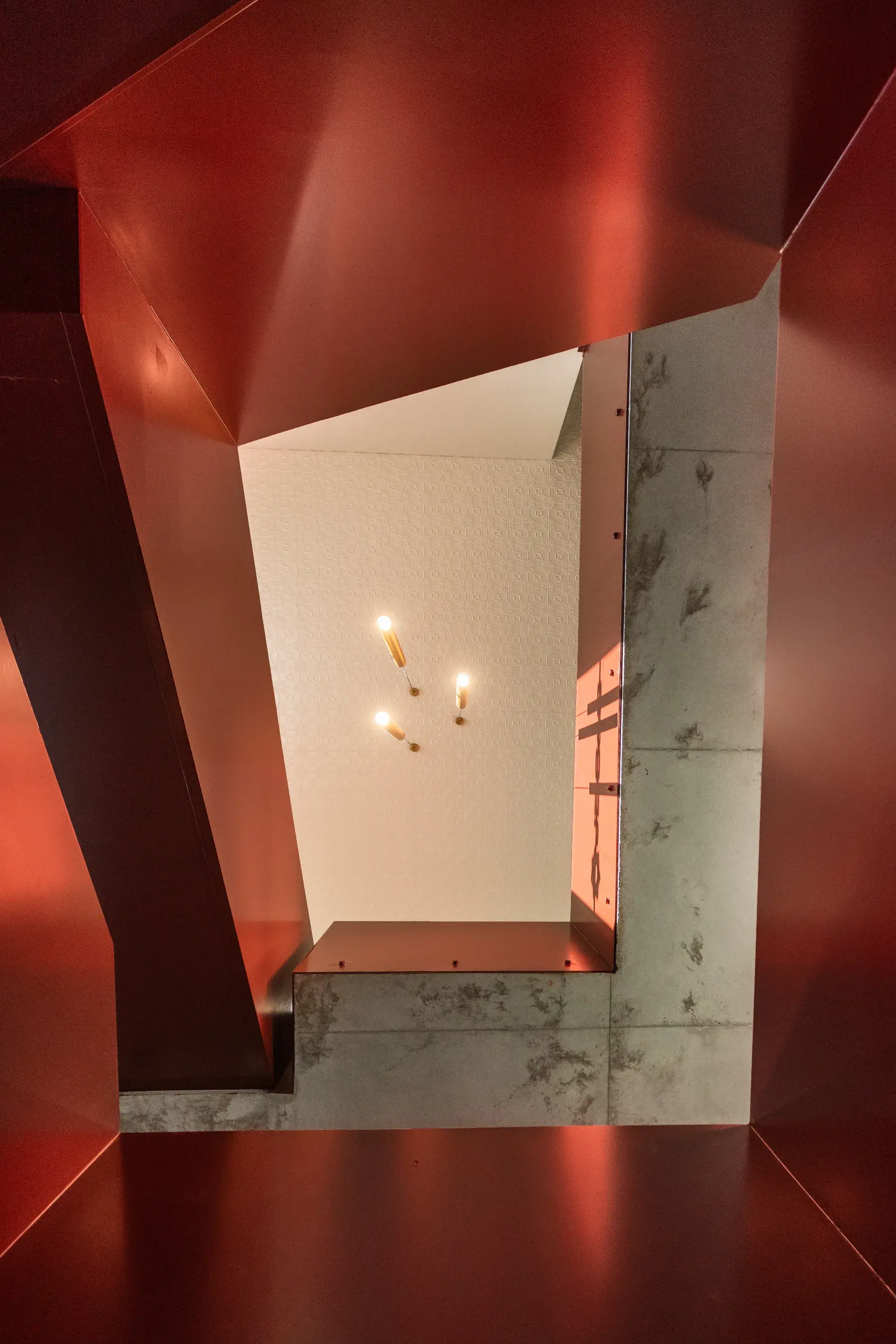 A view up through the staircase to the new pendant lights.