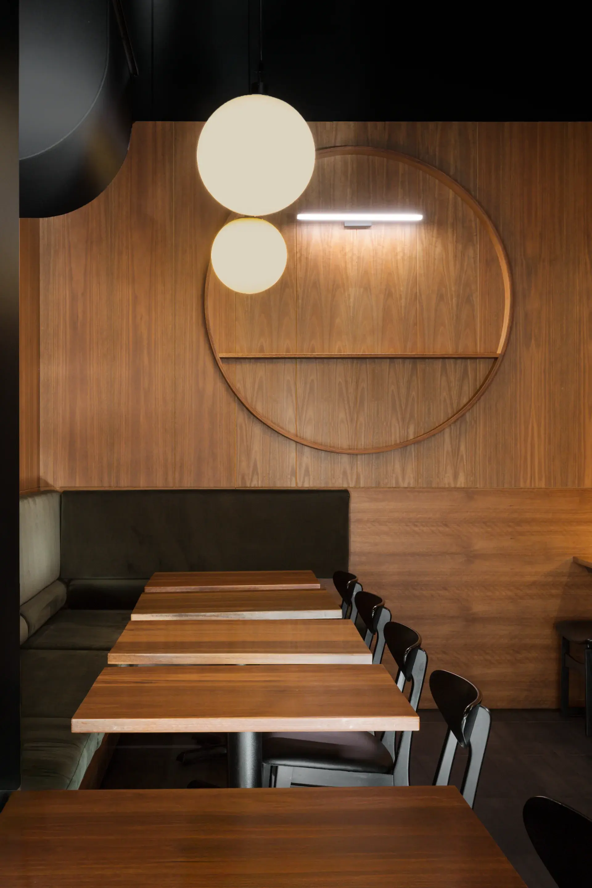 Spotted gum wall panelling in vertical and horizontal arrangements references traditional Japanese interiors.