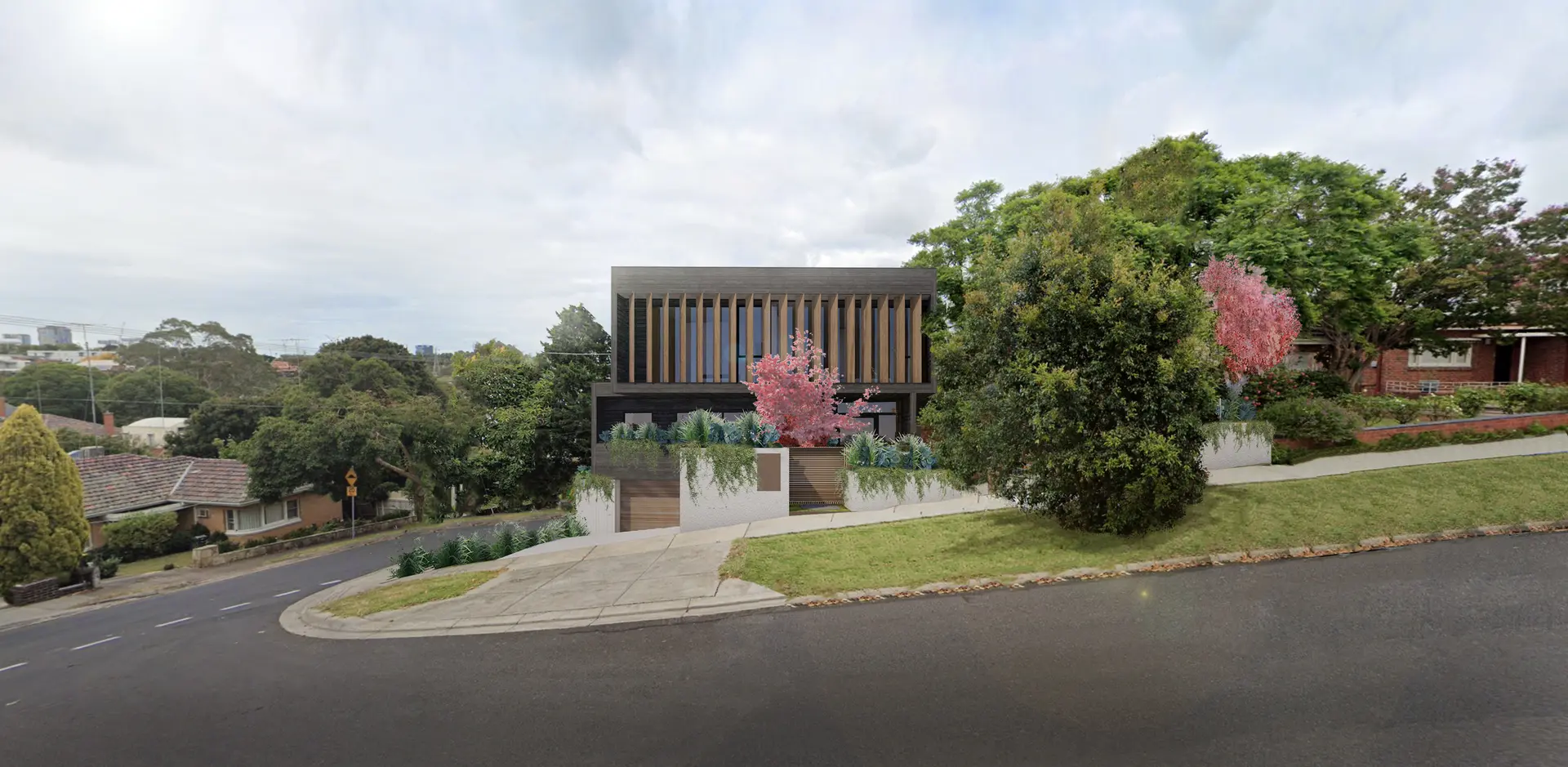 A digitally rendered street view of the residence, defined by a dark grey rectilinear upper volume screened with vertical timber battens, set behind layered planting vining plants hanging over the low masonry boundary fence. The residence sits on a sloping suburban corner site.