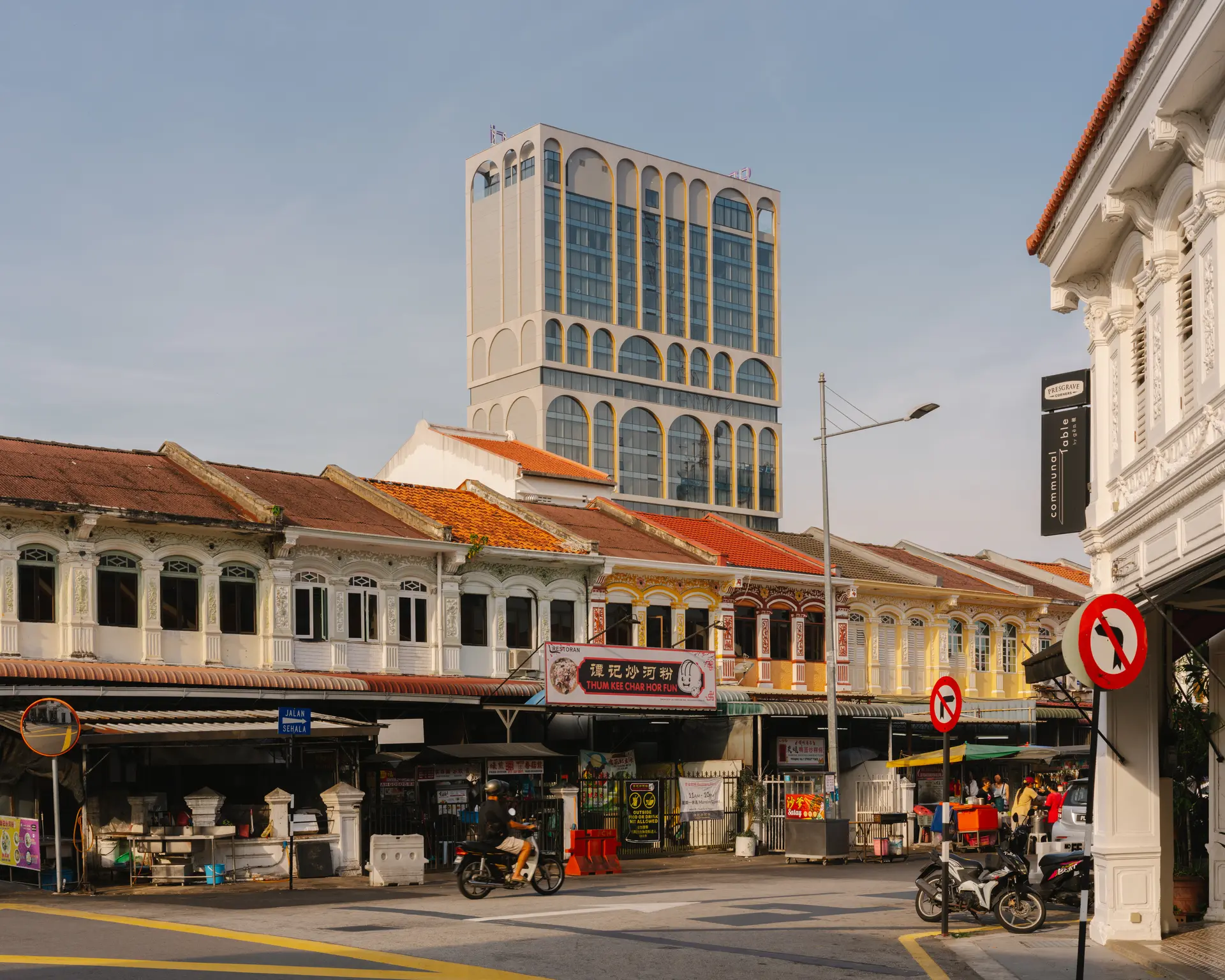 Capri Penang's arched tower rising above busy streets of George Town.