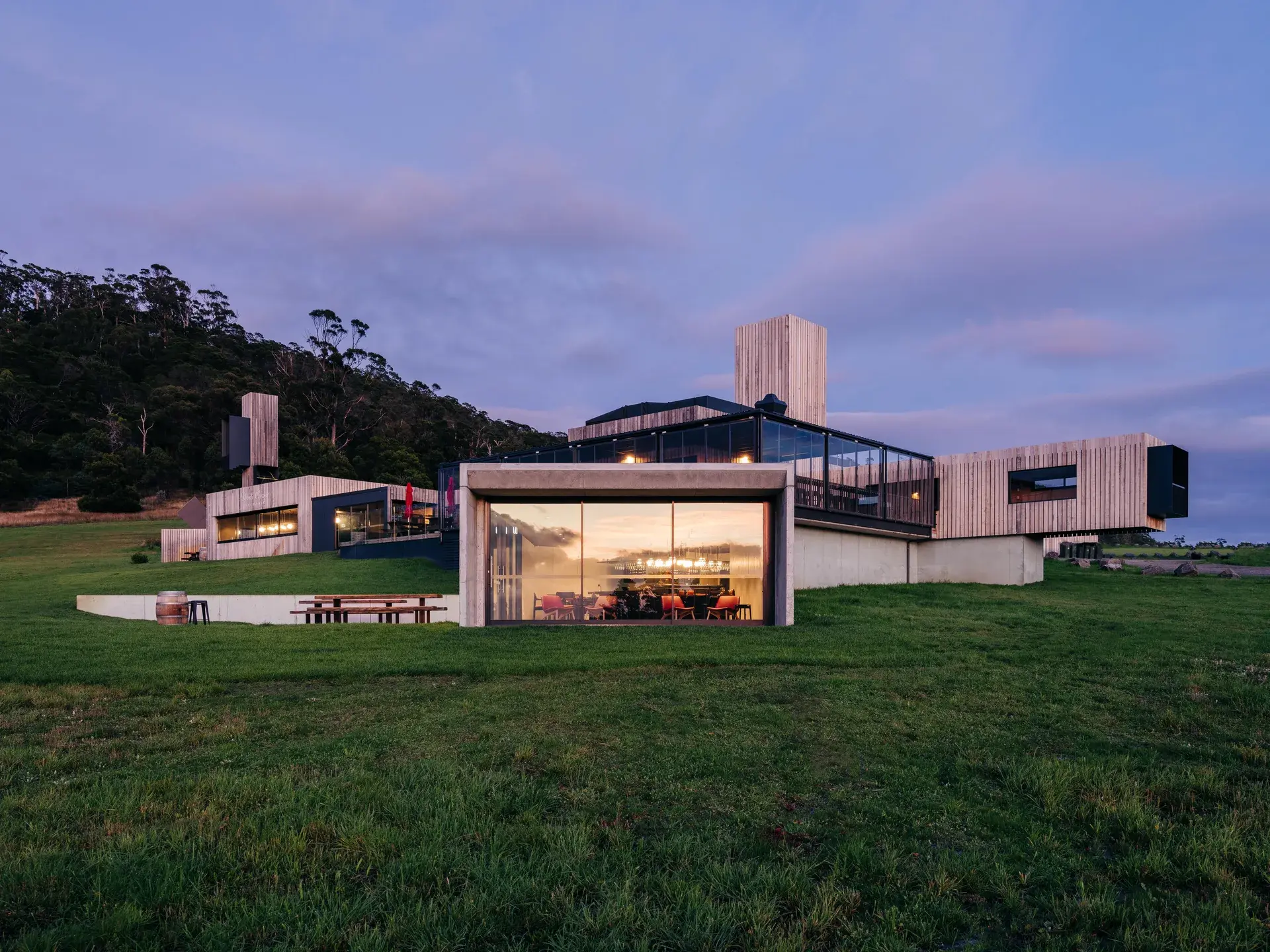The extension to the Devil's Corner winery with large windows reflecting the dawn sky.