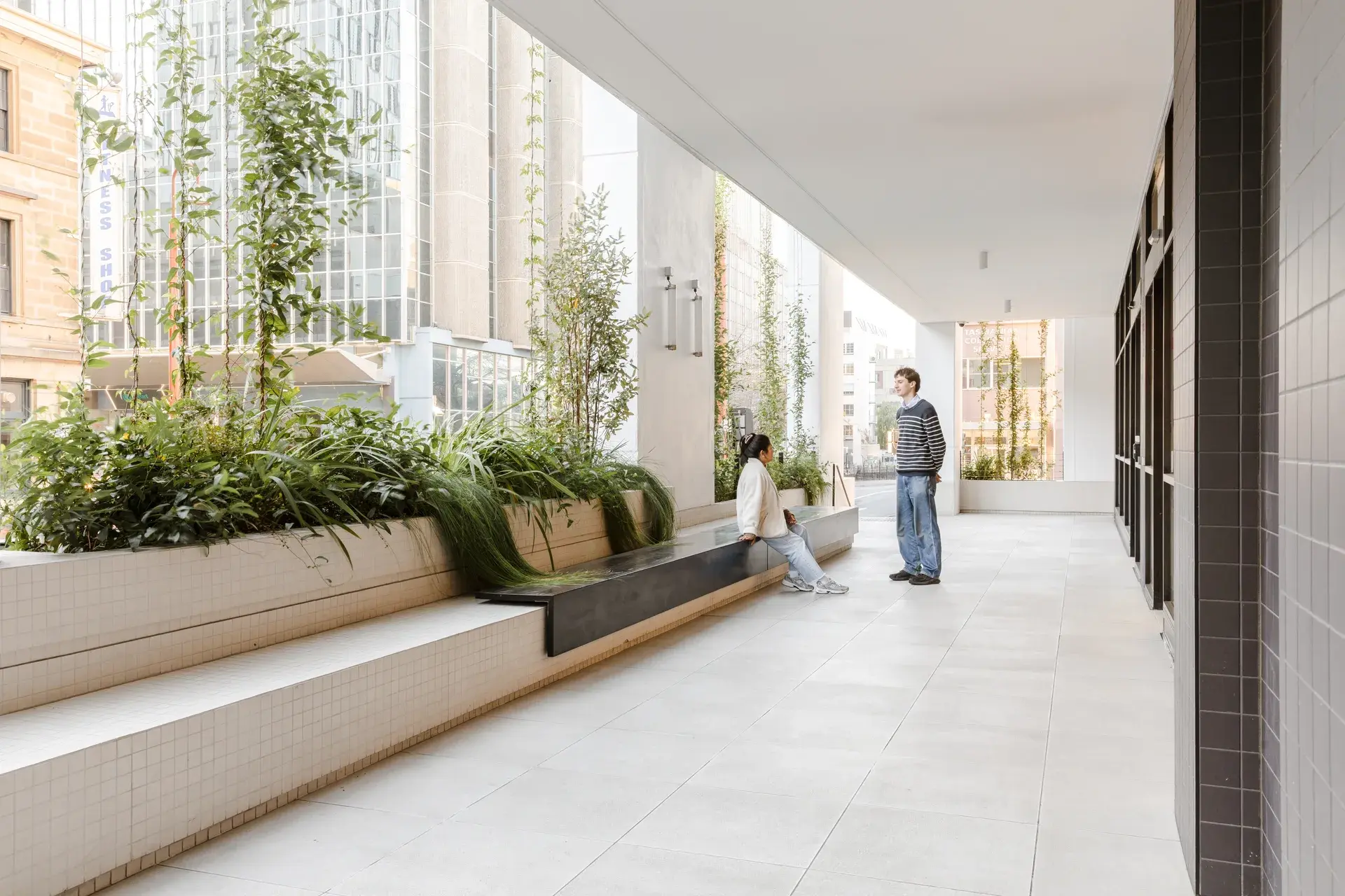 The public colonnade with the new long bench seating and planting.